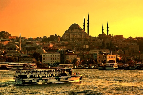 2 Guys talking on a wall waiting to cross the Bosphorus, Istanbul, Turkey