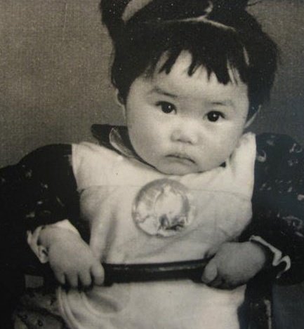 Matushka Patricia, when a baby in Guizhou, China. She moved to Hong Kong at the age of 6, and to the United States at the age of 16. That button she is wearing is a Mao button.
